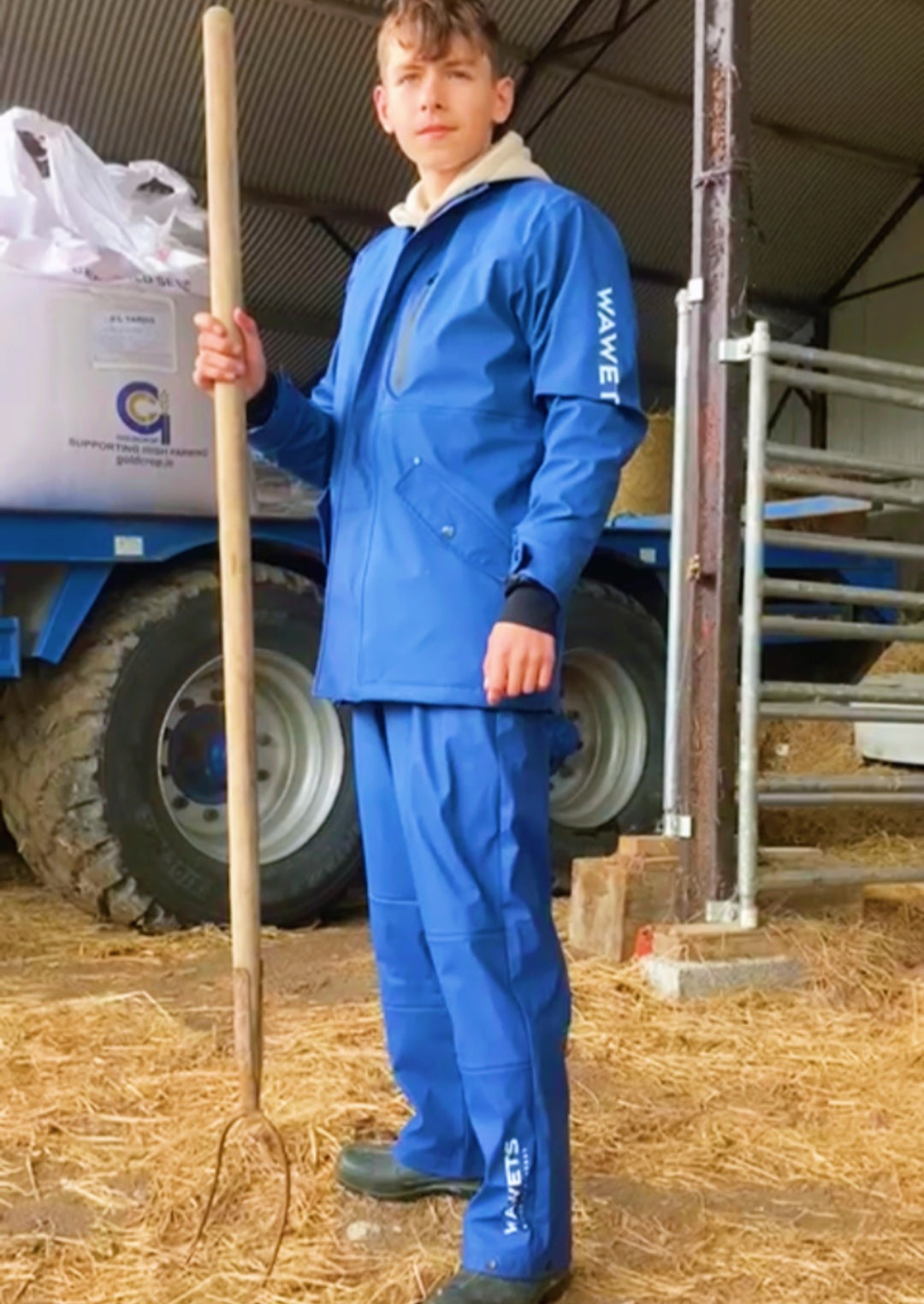 "Man wearing Wawets Blue/navy waterproof agri coat & matching durable comfortable pants/trousers designed in ireland"